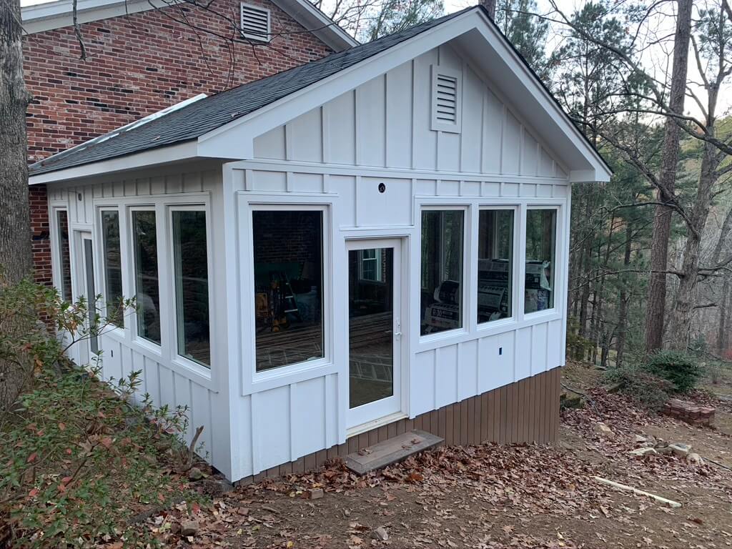 Stunning Four Season Room Addition, white James Hardie Exterior with Large Marvin Windows and Door