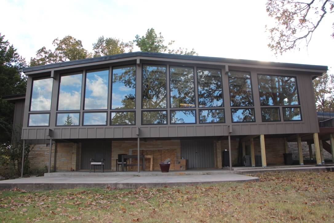 Floor to ceiling windows on screened in porch conversion